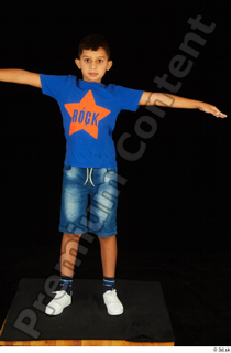 Timbo blue t shirt jeans shorts standing t poses white…